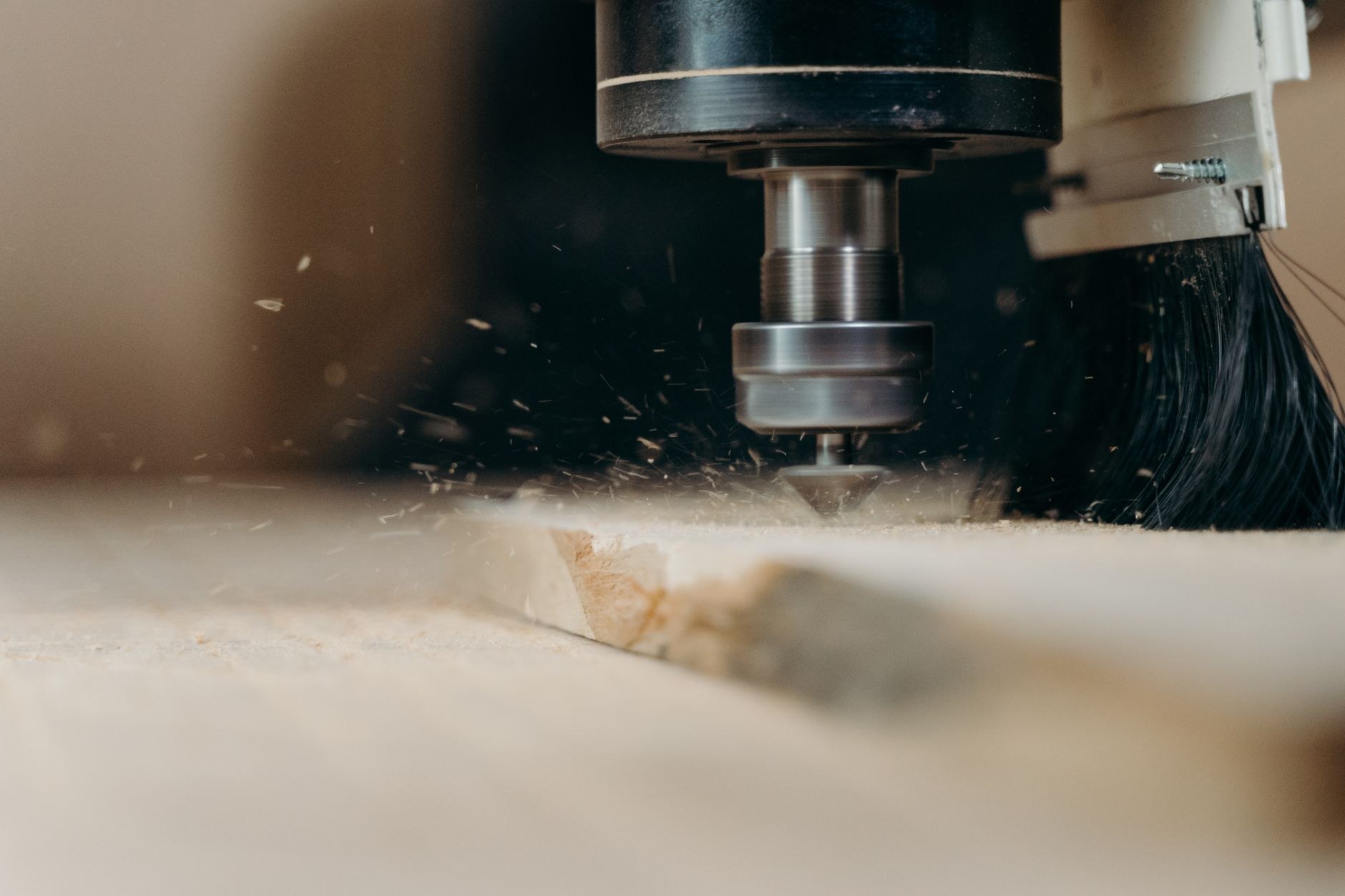 Sawdust flying as logs are cut to length