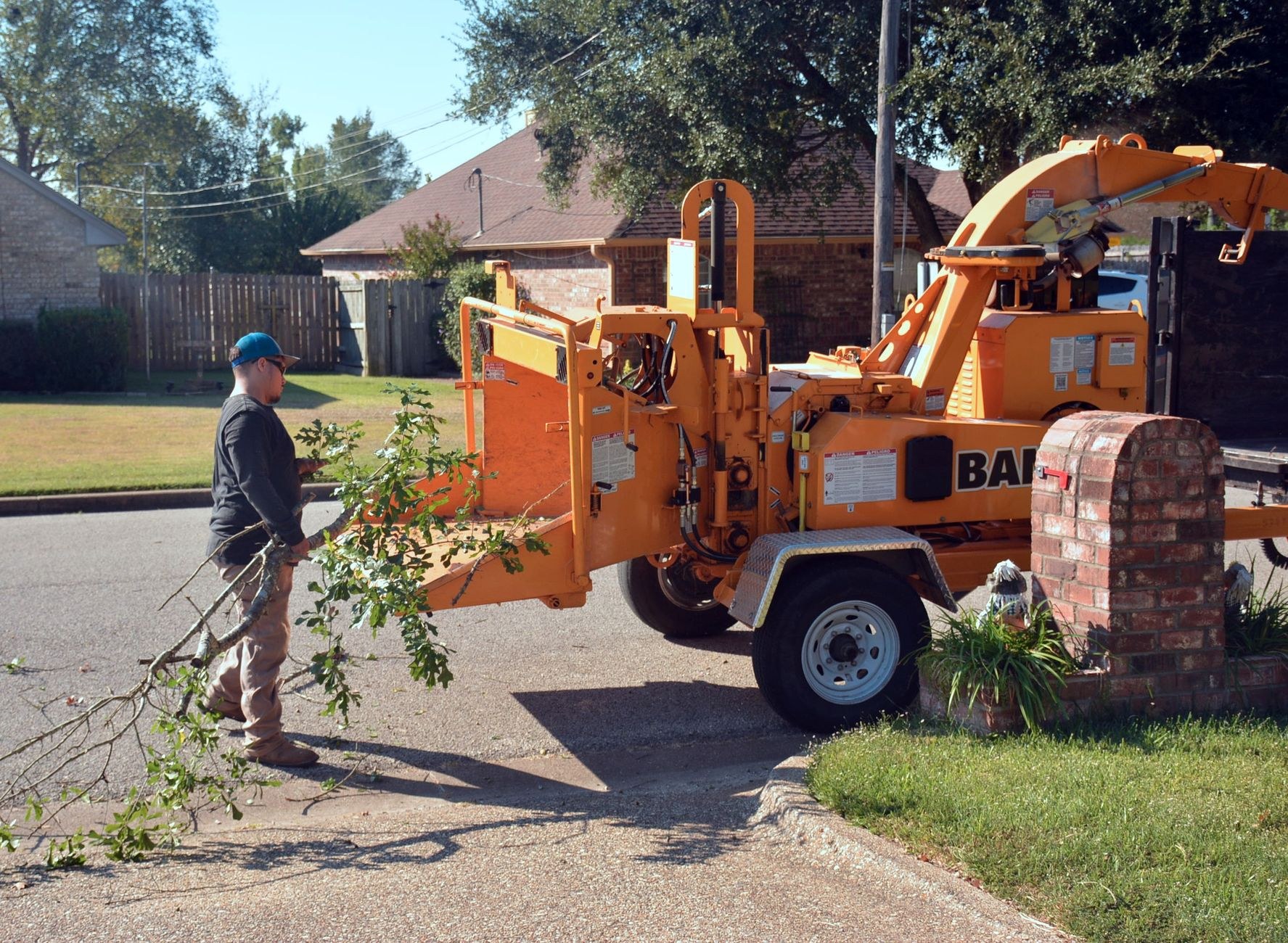 Wood chipper processing brush on site